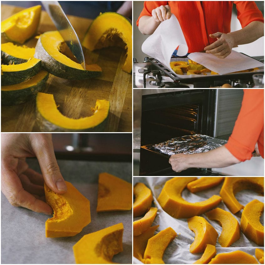 Fette di zucca tagliate a spicchi e infornate su carta da forno fino a diventare tenere