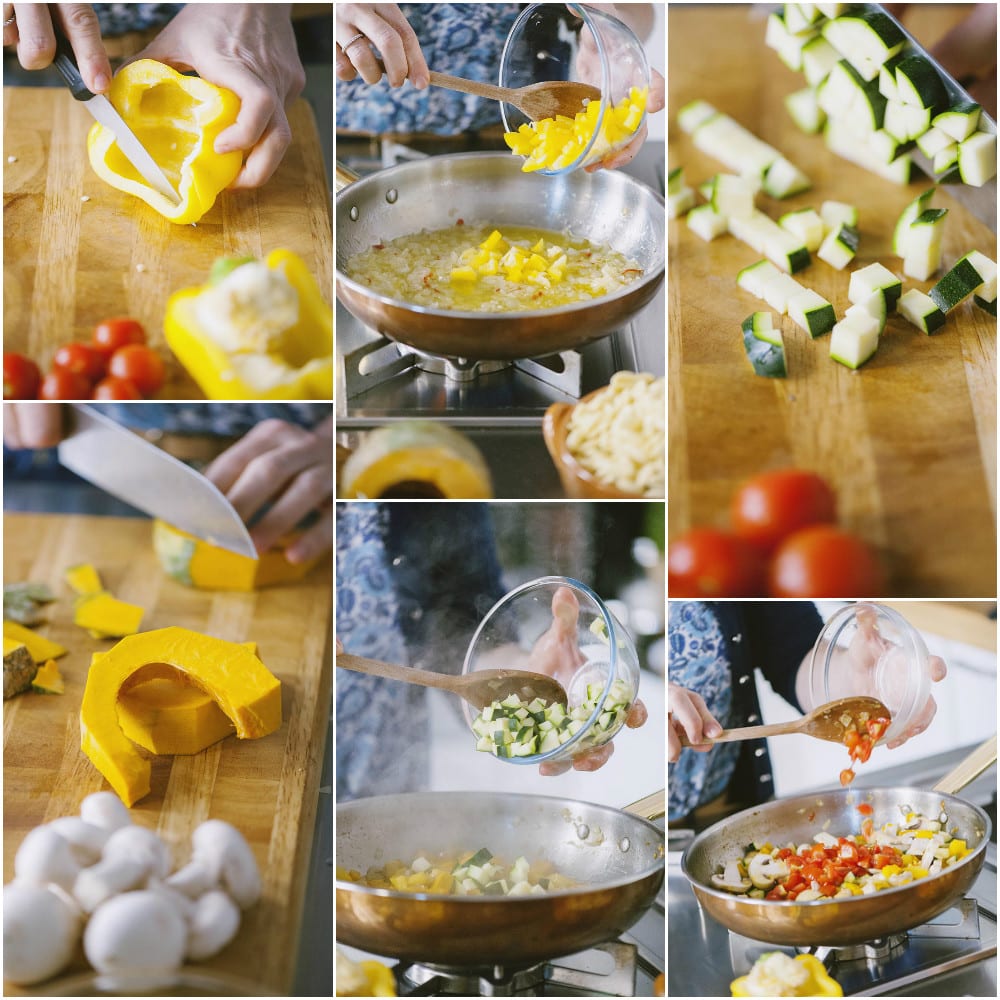 Verdure tagliate a cubetti aggiunte una alla volta in padella per il ragù di verdure