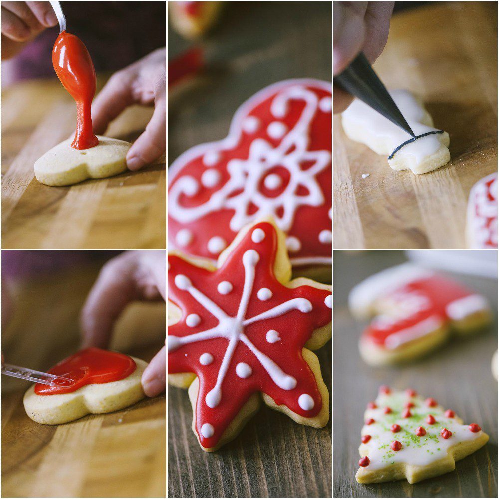 Biscotti di Natale decorati con glassa rossa e bianca a stelle, cuori e alberelli