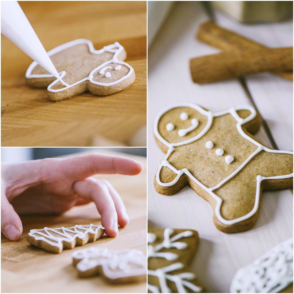 Decorazione dei biscotti pan di zenzero con ghiaccia reale applicata a sac à poche