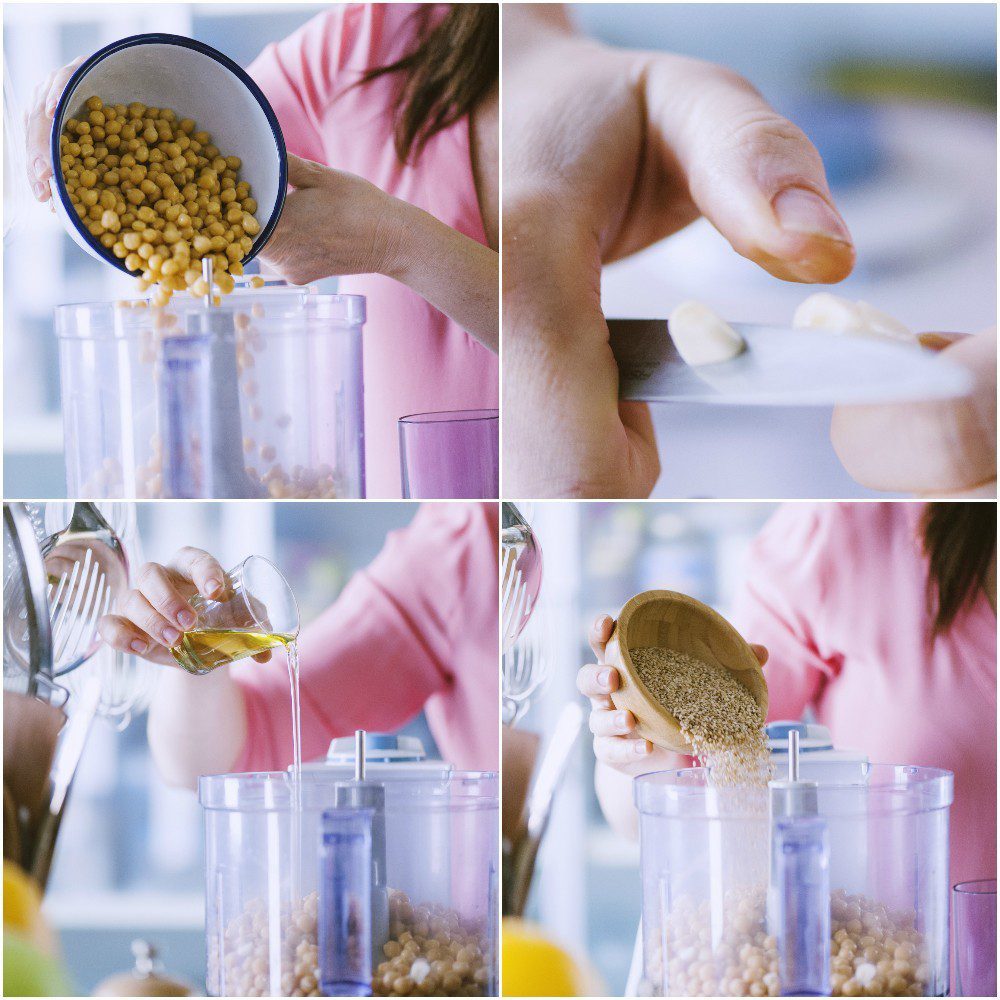 Ceci, aglio, olio e semi di sesamo versati nel frullatore per preparare l'hummus