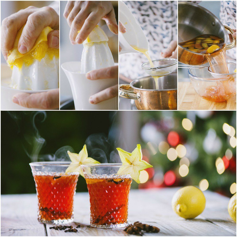 Succo di agrumi filtrato in un colino e punch di Natale fumante nei bicchieri con carambola