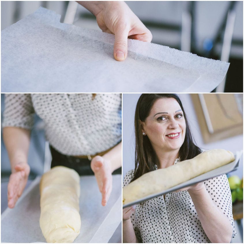 Strudel di mele sulla teglia con piccoli tagli praticati sulla superficie prima della cottura