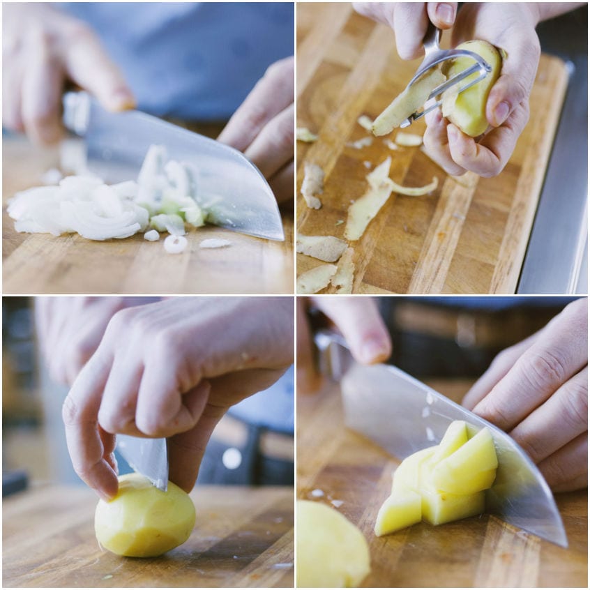 Aglio tritato sul tagliere, patate pelate e tagliate a cubotti con il coltello