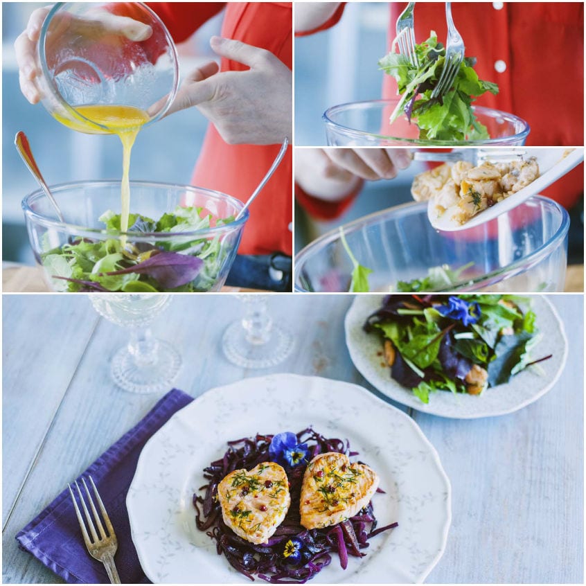 Dressing dorato versato su misticanza fresca, con pezzi di salmone spadellato aggiunti all'insalata
