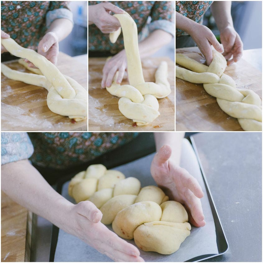 Mani che intrecciano strisce di pasta lievitata, poi sistemano la treccia formata su carta forno