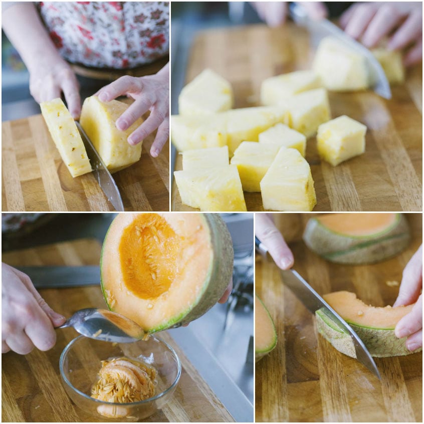 Ananas tagliato a cubetti e melone svuotato dai semi e affettato sul tagliere