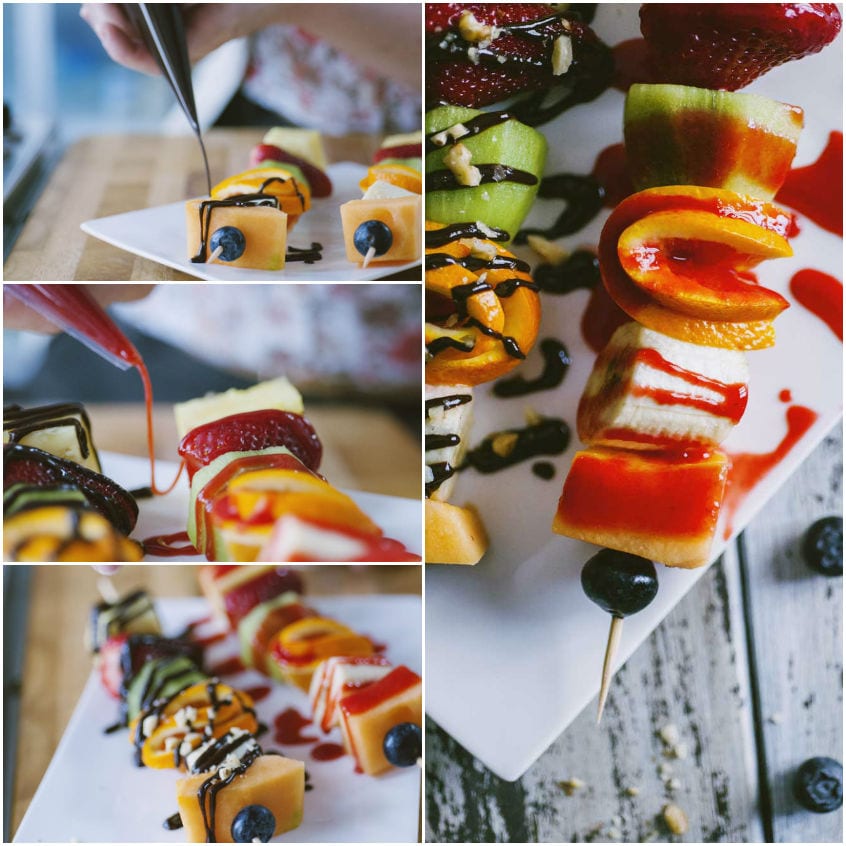 Spiedini di frutta guarniti con coulis di frutti rossi e fonduta di cioccolato