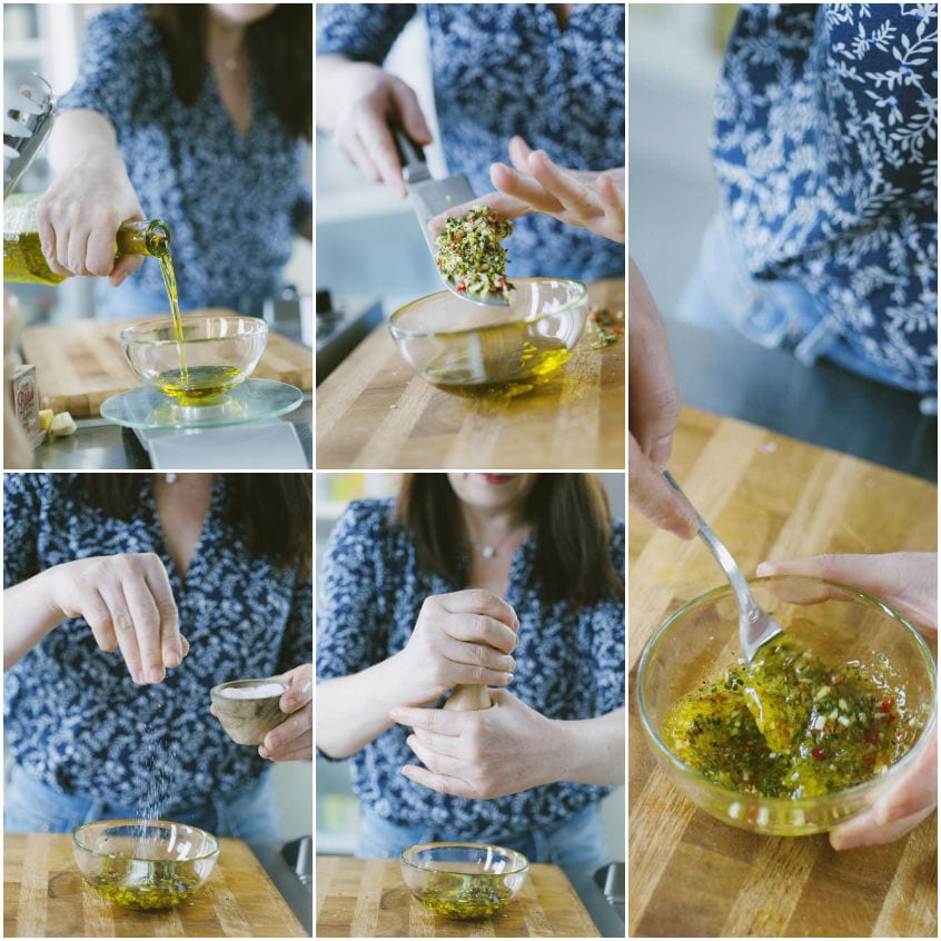 Preparazione della marinata con olio, erbe tritate e peperoncino mescolati insieme