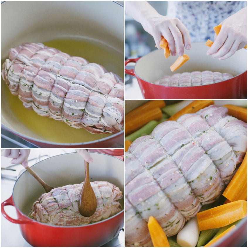 Arrosto di vitello in gabbia crudo adagiato in pentola con carote, sedano e aglio prima della rosolatura