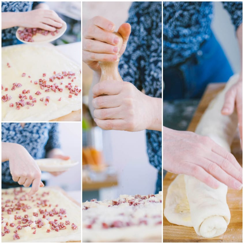 Salame e provolone a cubetti sparsi sull'impasto steso, poi arrotolato a formare un salsicciotto
