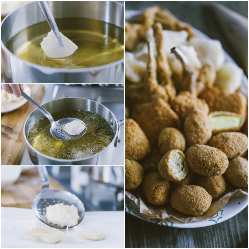 Olive ascolane fritte dorate accanto a crocchette di formaggio appena scolate dall'olio bollente