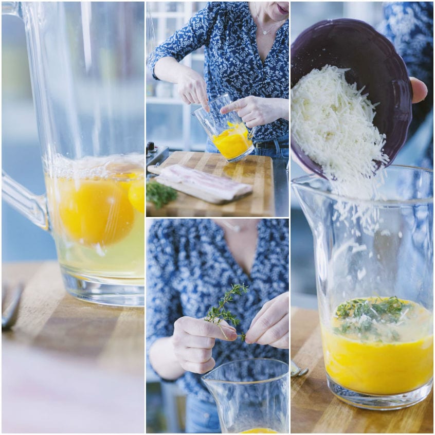 Uova sbattute in una caraffa con timo fresco e pecorino grattugiato versato dall'alto
