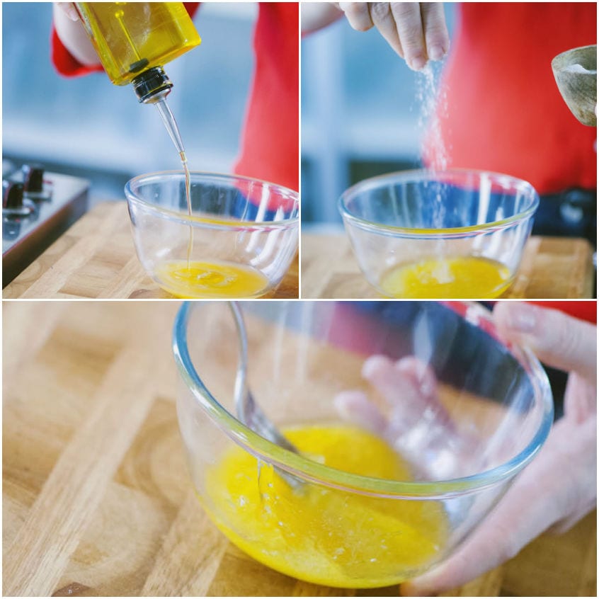 Olio versato sul succo d'arancia, poi sale aggiunto e tutto emulsionato a mano