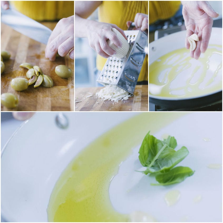 Olive tagliate a spicchi, ricotta salata grattugiata e aglio che sfrigola nell'olio con basilico fresco