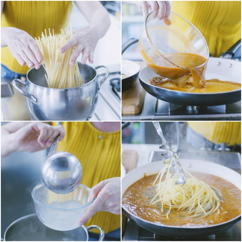 Spaghetti scolati al dente trasferiti nella padella con la bisque calda