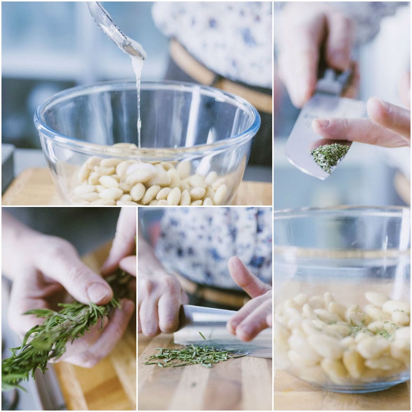 Mandorle condite con albume e rosmarino appena tritato in una terrina di vetro
