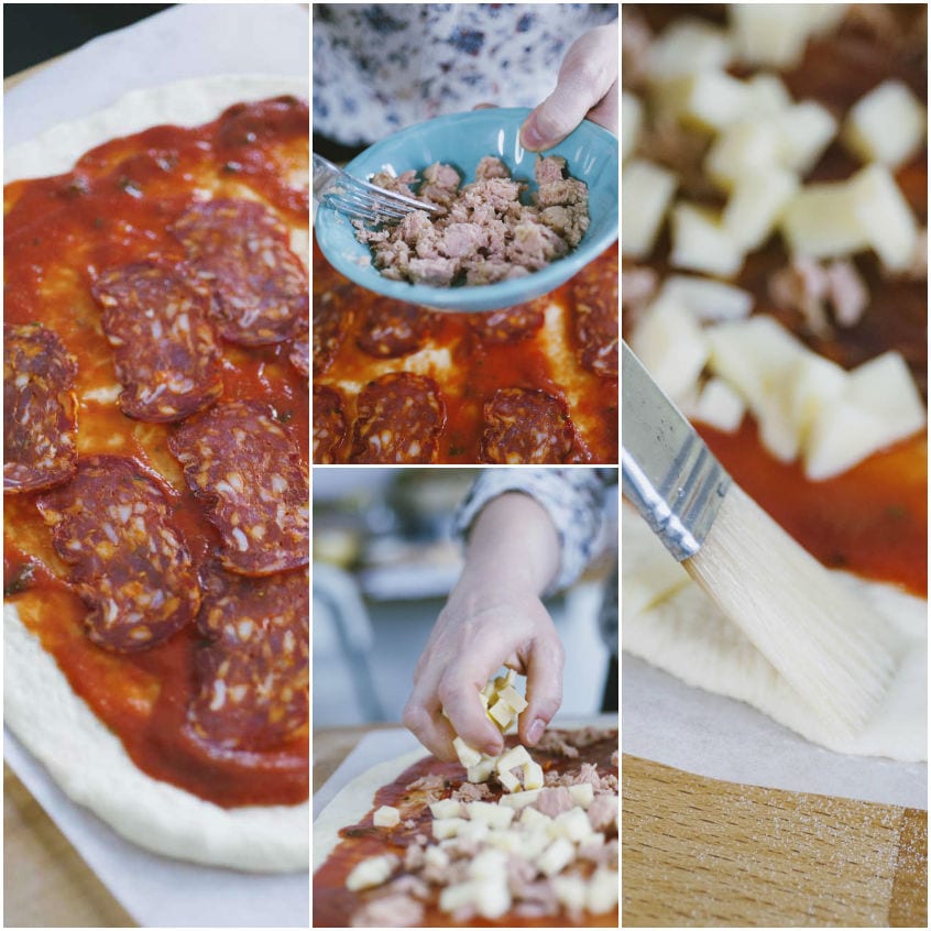 Farciture di salame, tonno e provola a cubetti disposte sulla base di pizza stesa