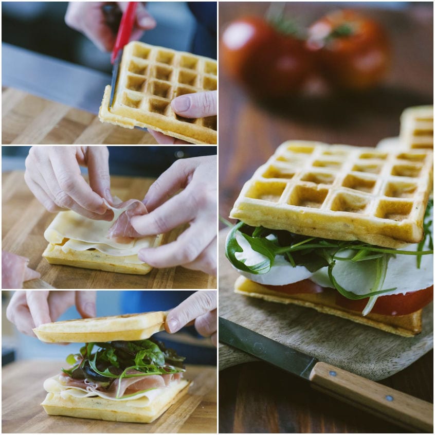 Waffle salati tagliati e farciti con prosciutto, formaggio e rucola su tagliere