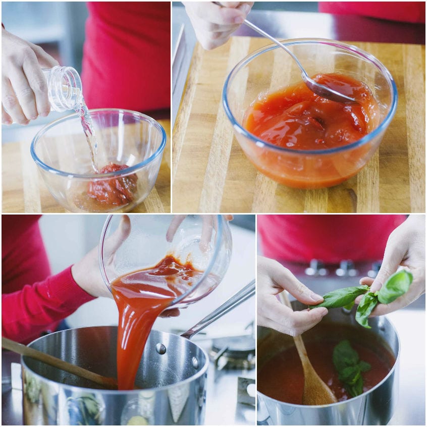 Concentrato di pomodoro stemperato in acqua, versato in pentola e completato con foglie di basilico fresco