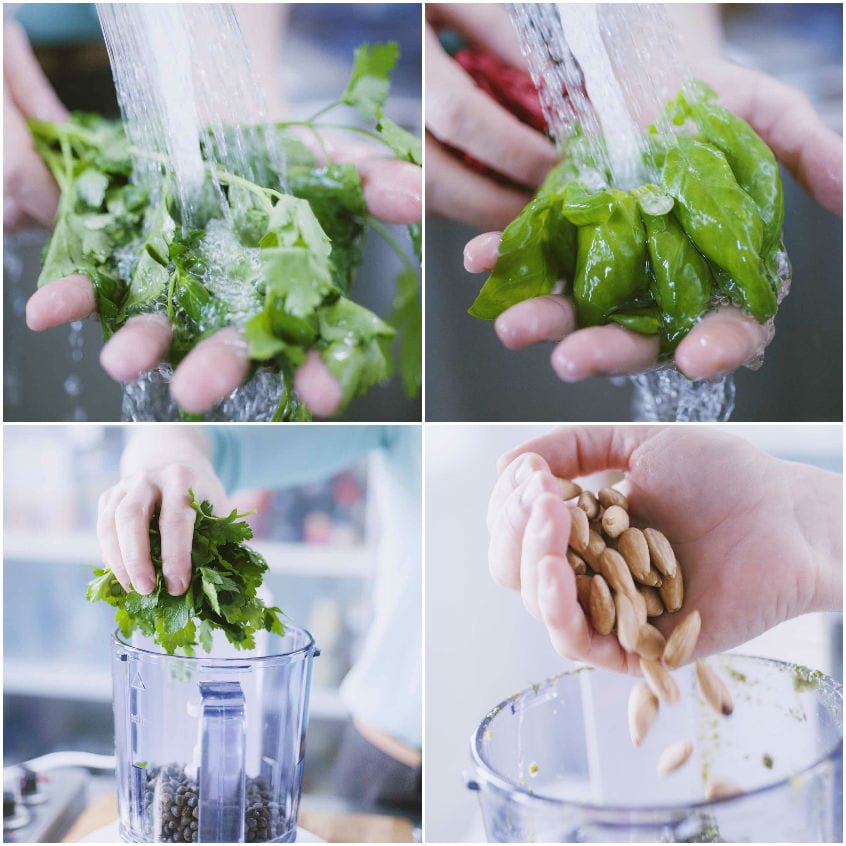 Lavaggio di basilico e prezzemolo sotto l'acqua corrente, poi aggiunti nel mixer con le mandorle
