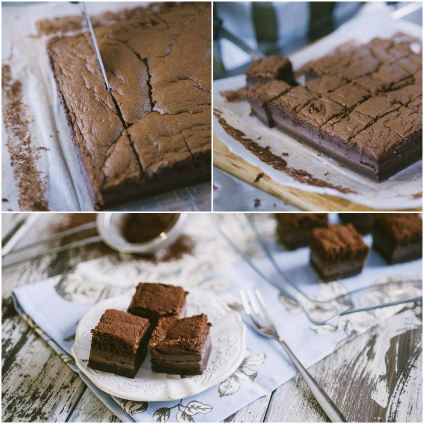 Torta magica al cacao tagliata a quadrotti e spolverizzata con cacao amaro in polvere