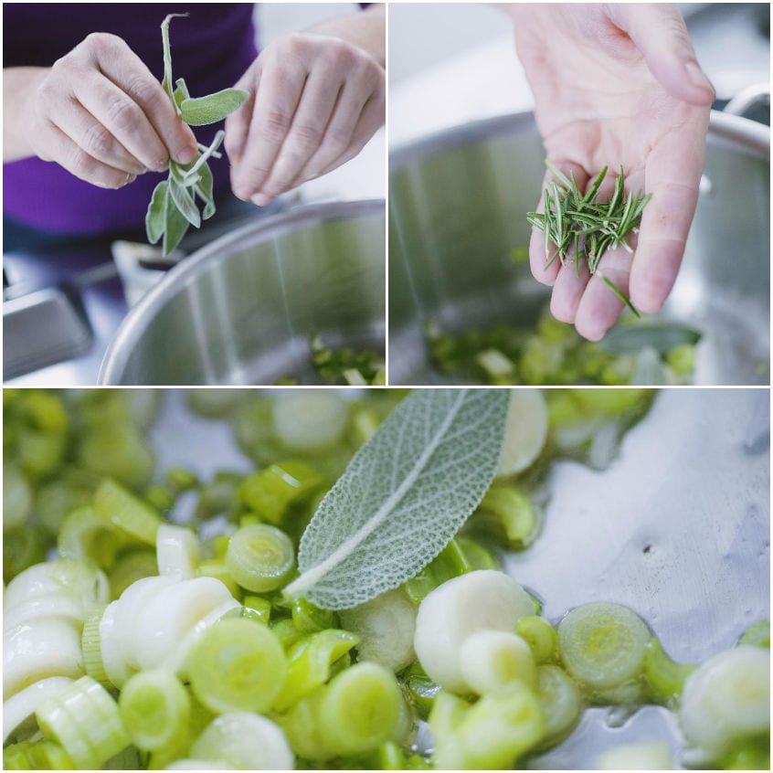 Mani che aggiungono salvia e rosmarino freschi al soffritto di porri in pentola