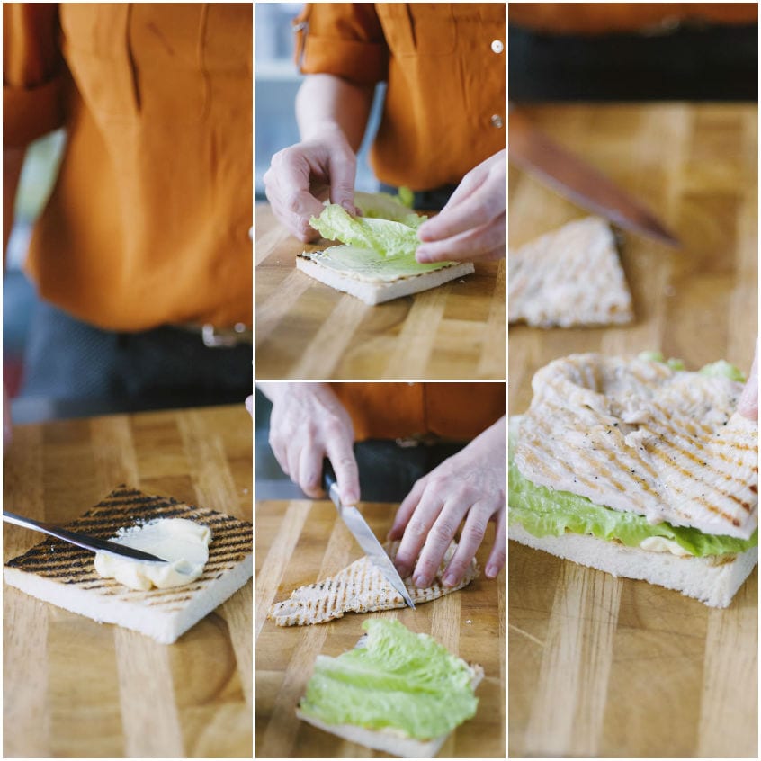 Composizione del clubhouse sandwich con maionese, lattuga e petto di pollo grigliato tagliato su pane tostato