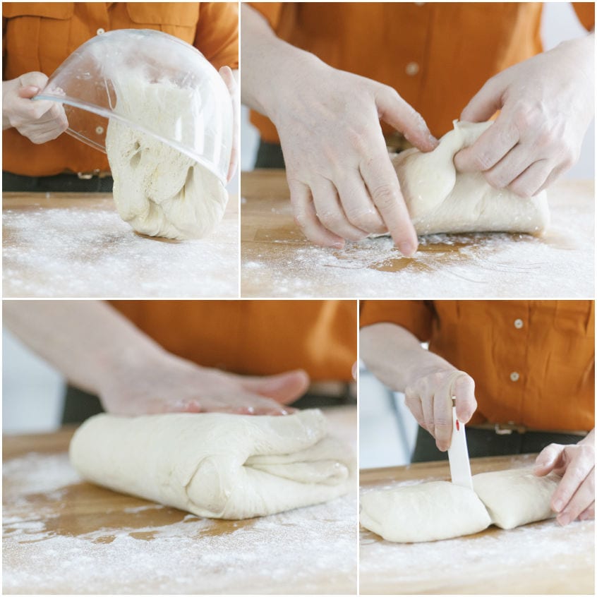 Impasto lievitato piegato e diviso in due parti con un tarocco sul piano infarinato