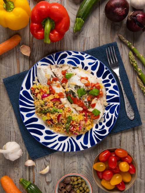 Orata al cartoccio con cous cous di verdure, pomodorini, basilico e lamelle di mandorle