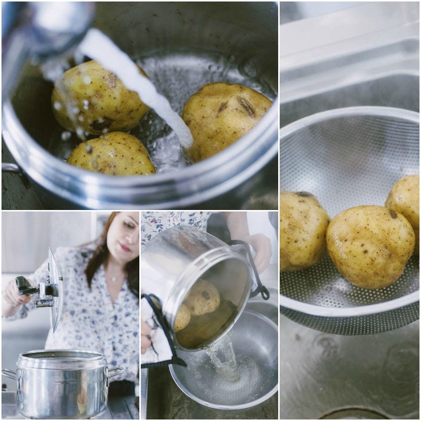 Patate intere lavate sotto l'acqua corrente, poi scolate in uno scolapasta dopo la cottura