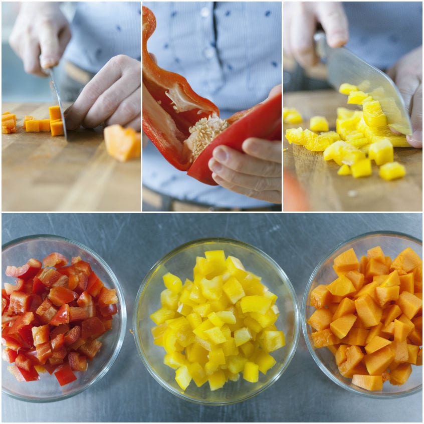 Peperoni rossi e gialli e zucca tagliati a cubetti raccolti in ciotole separate