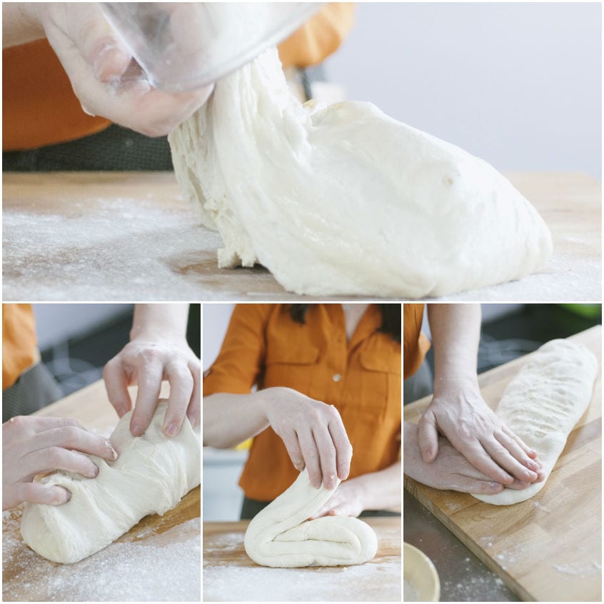 Mani che piegano e modellano l'impasto del pane sul piano infarinato