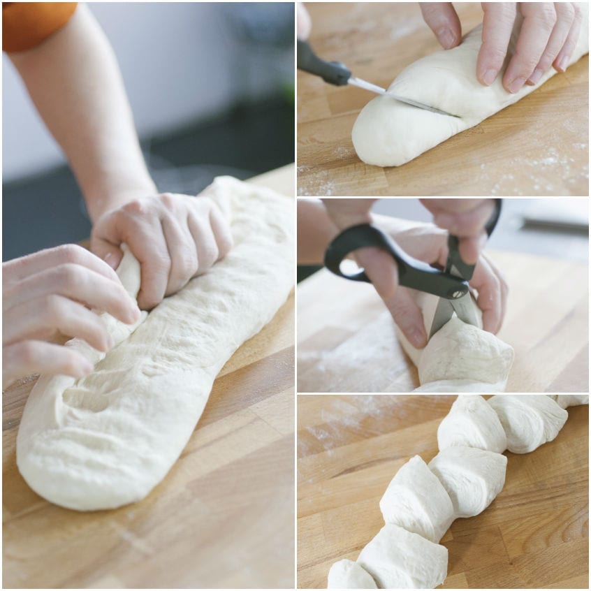 Mani che modellano un filoncino di pasta e forbici che incidono l'impasto per formare la spiga di pane