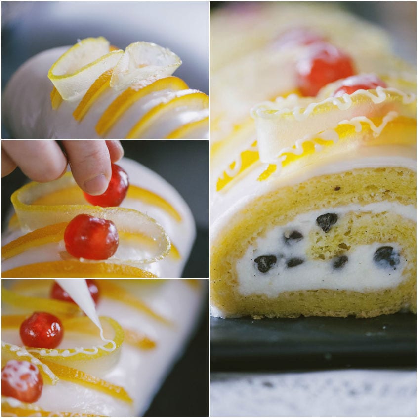 Rotolo di cassata decorato con scorze candite, ciliegine rosse e glassa, sezione con ricotta e gocce di cioccolato