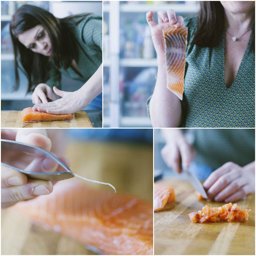 Pulizia del salmone: separazione della pelle, rimozione delle lische con pinzetta e tritatura della polpa