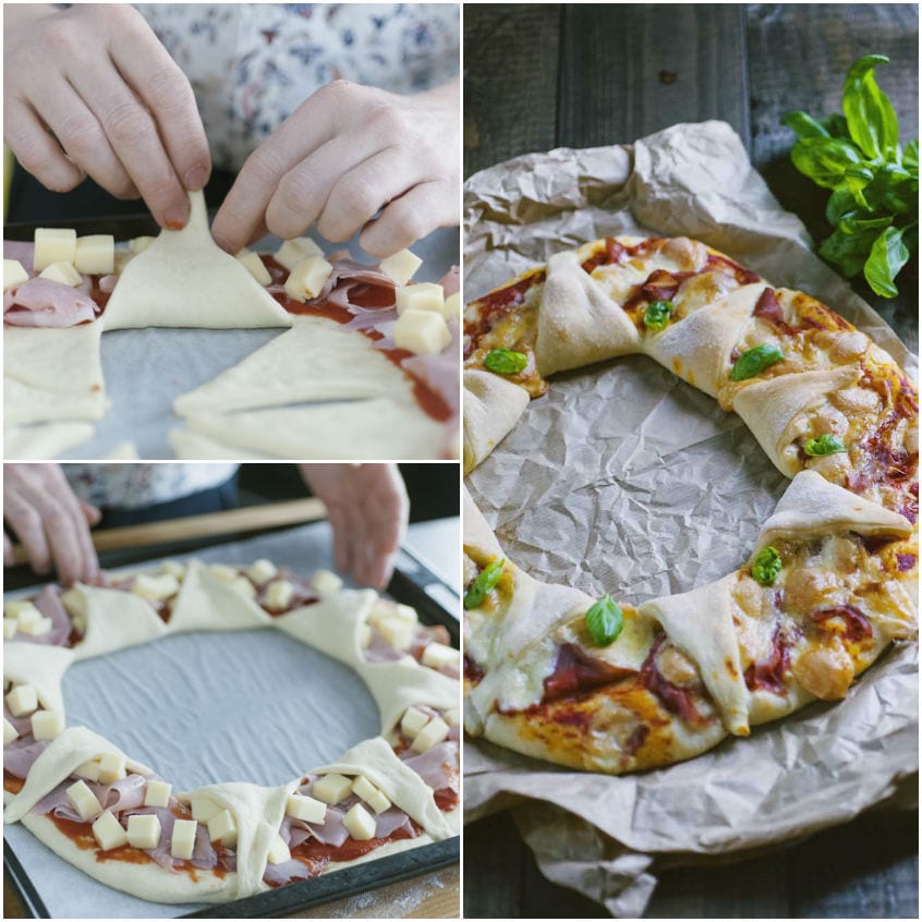 Mani che ripiegano gli spicchi di pasta sulla ghirlanda farcita con salumi e formaggio, poi cotta e guarnita con basilico