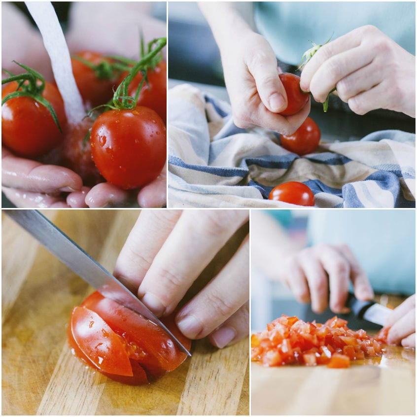 Pomodori lavati, mondati dal picciolo e tagliati a dadini fini sul tagliere