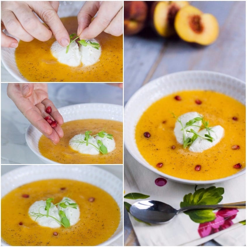 Mani che aggiungono germogli e chicchi di melograno sulla feta nel gazpacho di melone