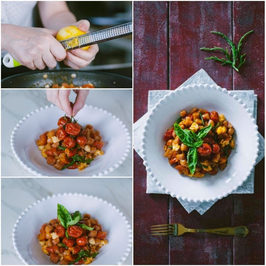 Mani che aggiungono pomodorini confit su un piatto con ceci e basilico fresco
