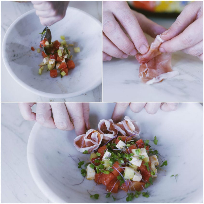 Roselline di prosciutto composte a mano accanto a cubetti di anguria, feta e cetriolo nella ciotola