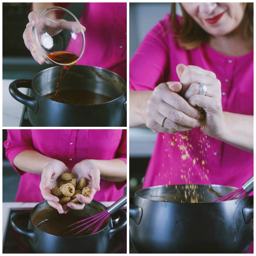 Mani che aggiungono rum e amaretti sbriciolati al composto di cioccolato in pentola