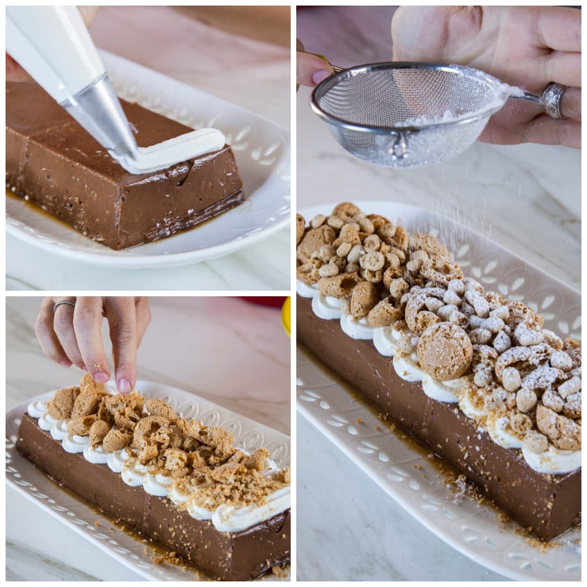 Budino al cioccolato decorato con ciuffi di panna, amaretti sbriciolati e zucchero a velo setacciato