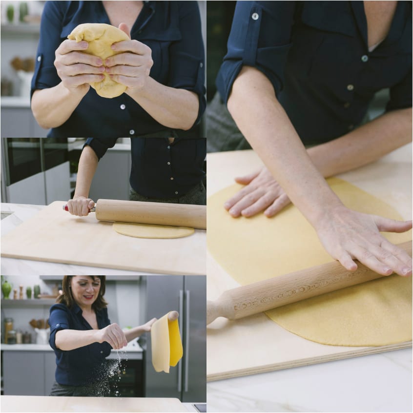 Mani che lavorano l'impasto all'uovo e lo stendono col mattarello fino a una sfoglia sottile