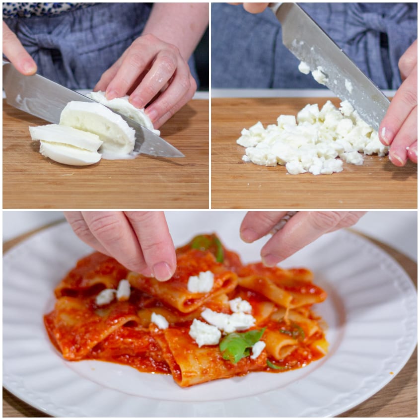 Mozzarella di bufala tagliata a cubetti e distribuita sui paccheri al pomodoro con basilico