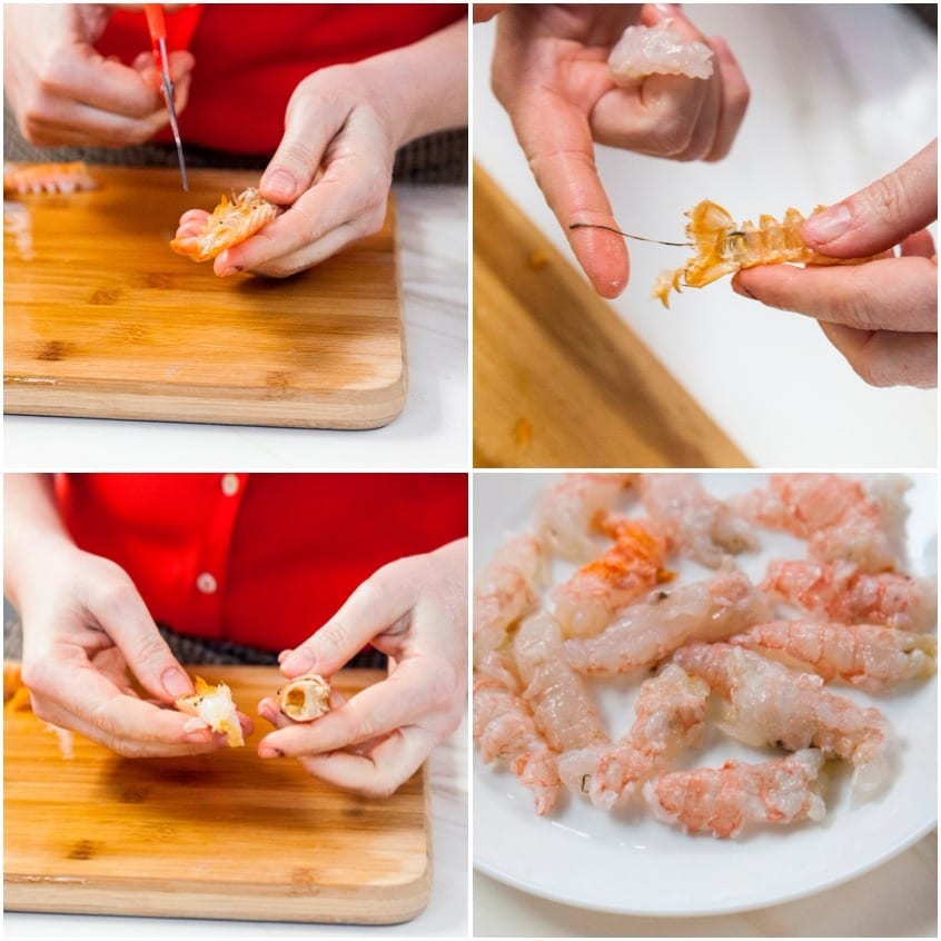 Mani che sgusciano gli scampi crudi: incisione della corazza, rimozione del filo intestinale e polpa pulita