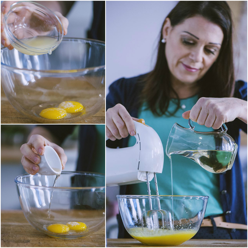 Donna aggiunge olio a filo con le fruste elettriche al composto di tuorli per la maionese