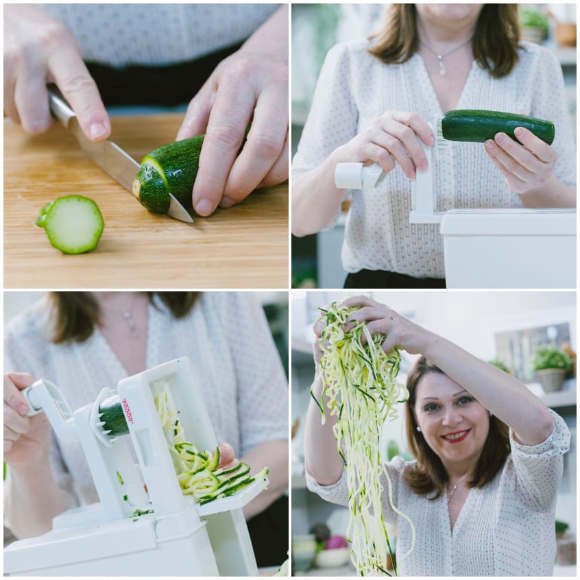 Zucchine tagliate alle estremità e poi spiralizzate fino a ottenere lunghi spaghetti di zucchine