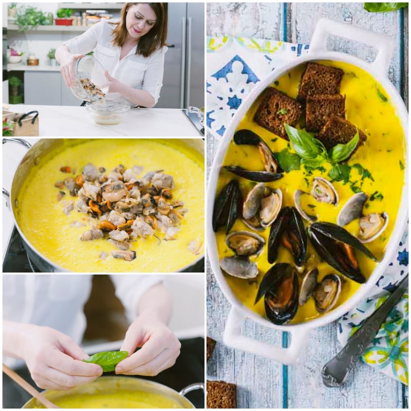 Vellutata con cozze e vongole intere su crema allo zafferano, guarnita con basilico e crostini di pane scuro