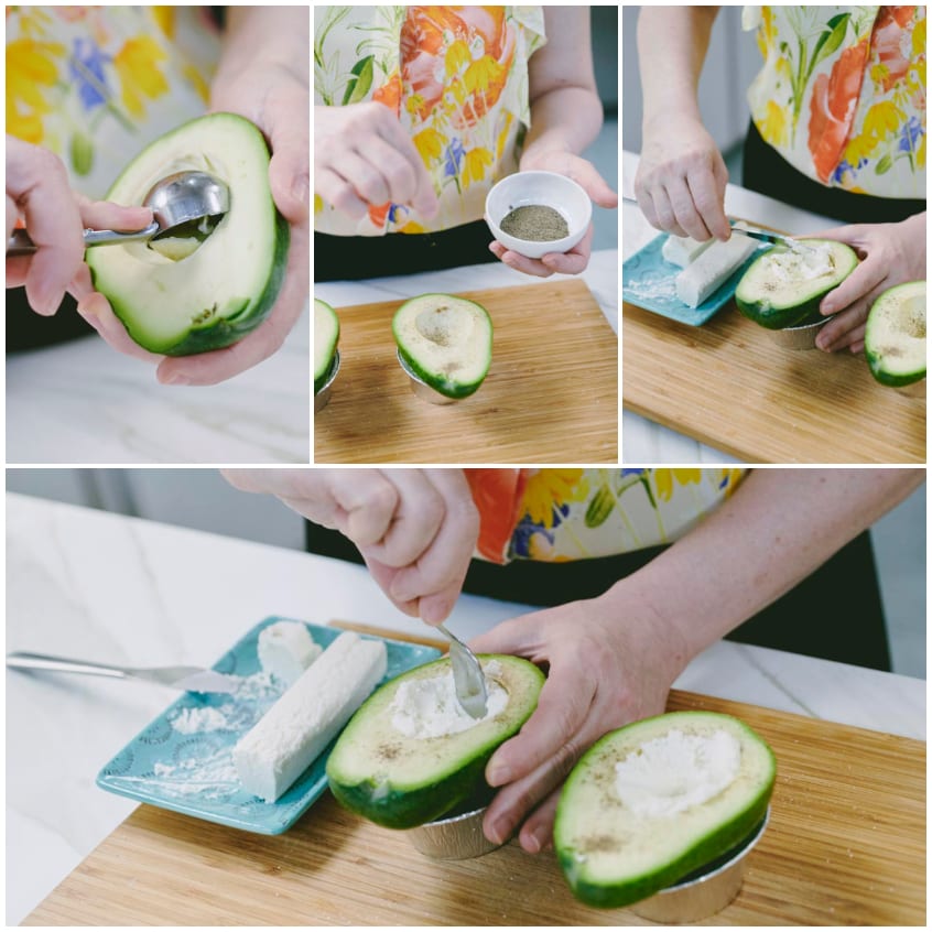 Mani che riempiono le metà di avocado con caprino fresco e creano una conca con il cucchiaino